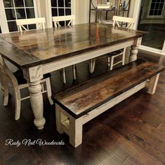 a dining table with two benches in front of it