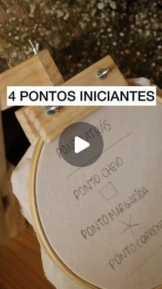 a video demonstrating how to use an embroidery hoop on a piece of wood with the words pontos inciantes