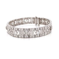 This is a beautiful retro inspired diamond link platinum bracelet. Covered by splendid round cut white natural diamonds 10.21 ct in total. Diamonds are all natural in G-H Color Clarity VS. Platinum 950 metal. Length: 17.4 cm Width. 1 cm Weight: 31 g Art Deco Diamond Jubilee Bracelet, Art Deco Diamond Tennis Bracelet With Brilliant Cut, Art Deco Diamond Tennis Bracelet With Single Cut Diamonds, Art Deco Platinum Tennis Bracelet With Diamond Accents, Art Deco Platinum Diamond Bracelet, Vintage Platinum Diamond Bracelet With Single Cut Diamonds, Art Deco White Gold Diamond Bracelet With Brilliant Cut, Art Deco Round Diamond Bracelet Brilliant Cut, Art Deco Diamond Tennis Bracelet For Anniversary