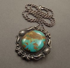 See More Vintage Native American Jewelry here: https://www.etsy.com/shop/YearsAfter?section_id=13095973 Sale! Orig $775 A Spectacular Vintage Native American Navajo Turquoise Necklace Pendant Brooch handmade by Legendary Navajo Artist Kirk Smith (1957-2012) in Sterling Silver with a Thick Gorgeous Slab of Natural Pilot Mountain Turquoise in a Green Blue Color with a Chocolate Brown Matrix on 22" Vintage Sterling Rope Chain, All Tested and Guaranteed Sterling, Early KS Sterling Hallmark, Shepard's Hook Hidden Bale, Safety Closure, Weighty 52.7 Grams circa 1970 to 1980's!  Approx. Measurements: Pendant is 2-1/4" in length by 2-1/8" wide. Turquoise is 1-5/16" in length. Sterling Chain is over 22" in length. Unisex for both Men and Women! This Magnificent Pendant is a Rare Early Beauty! The Pi Western Style Turquoise Pendant Necklace, Western-style Turquoise Necklace With Large Pendant As Gift, Western Style Turquoise Necklace With Large Pendant, Western Turquoise Necklace With Large Pendant For Gifts, Western Style Turquoise Necklace With Large Pendant As Gift, Untreated Western Style Jewelry For Gifts, Southwestern Style Engraved Turquoise Necklaces, Southwestern Turquoise Necklace With Patina, Southwestern Engraved Turquoise Necklace