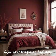 a bedroom with red walls and white bedding