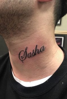 a man's neck with the word sasha tattooed on his left side ribcage