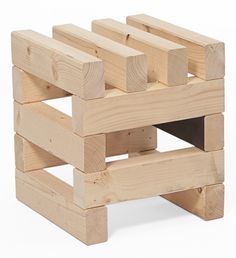 a wooden structure made out of multiple pieces of wood with one section missing from the top