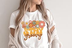 Very cute retro Stay groovy T-shirt! This will be perfect if you are looking for Hippie/boho style and great gift for family and friends! This classic unisex jersey short sleeve tee fits like a well-loved favorite. Soft cotton and quality print make users fall in love with it over and over again. These t-shirts have-ribbed knit collars to bolster shaping. The shoulders have taping for better fit over time. Dual side seams hold the garment's shape for longer.  .: 100% Airlume combed and ringspun Hippie Multicolor T-shirt For Spring, Hippie Letter Print Tops For Spring, White Floral Print Hippie Top, Hippie Tops With Funny Print For Spring, Hippie Top With Funny Print For Spring, Spring Hippie Top With Funny Print, Hippie T-shirt With Vintage Print For Summer, Retro Cotton T-shirt With Floral Print, White Retro T-shirt With Floral Print