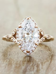 an engagement ring with a pear shaped diamond in the center