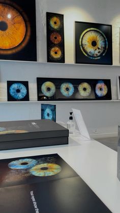 an exhibit room with several different types of eye prints on the wall and in front of them