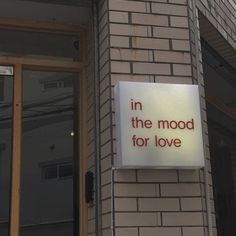 a sign on the side of a building that says, in the mood for love