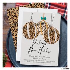 a leopard print christmas ornament card on a plate