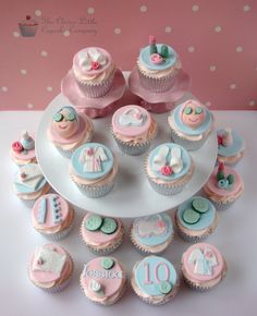 cupcakes are arranged in the shape of a baby's first birthday cake