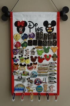 a mickey mouse bulletin board with lots of pins