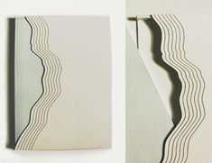 two photographs of white and black paper with wavy lines on the bottom one is folded in half