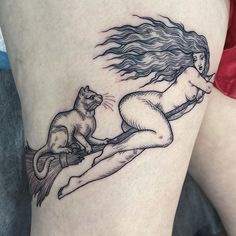 a woman with a cat on her thigh is depicted in this tattoo design by the artist