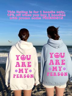 Give your best friend or partner the best gift of saying I love you with the 'You Are My Person' matching hoodie set! These are aesthetic and trendy gifts for your bestie, for couples or a fun way to send a message to BFF through social media : )  The BFF design with little flowers is printed on luxurious cotton mix material, and you can choose among various colors.  If you are looking for an oversized shirt, pick 2 sizes bigger, sizes up to 5 XL are offered for this model. Atelier Lemon Tree Co Bsf Hoodies, 2000s Girl Aesthetic, Bestie Hoodies Aesthetic, Bff Hoodies For 2, Bff Disney Hoodies, Bff Sweatshirts Hoodie Best Friends, Valentine's Day Casual Hoodie With Letter Print, Best Friend Hoodies, Couples Sweaters