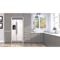 a white refrigerator freezer sitting inside of a kitchen next to a sink and window