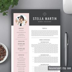 a pink and black resume template on top of a desk next to a cup of coffee