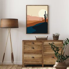 a living room with a dresser, lamp and painting on the wall