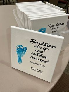 there are several cards with handprints on them sitting on top of a table