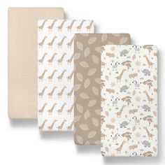 three sheets with giraffes and leaves on them