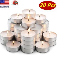 a stack of white candles sitting on top of each other in front of a white background