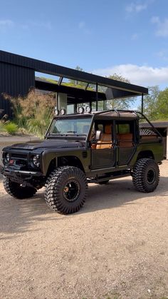 a black jeep parked in front of a building