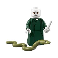 a lego figure with a snake in front of it