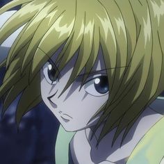 an anime character with blonde hair and blue eyes looks at the camera while staring into the distance