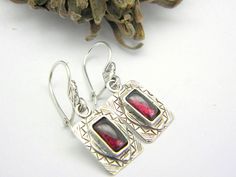 Garnet earrings sterling silver dangle - retro vintage style-Chandelier Dangle Earrings geometric rectangle january birthstone If you like retro style in jewelry this is a lovely pair of sterling silver garnet earrings. Rectangular shaped ,etched pattern in two layers and in the middle a genuine garnet gemstone 4*8 mm. designed in our workshop on Lesvos island in Greece The total length of the earrings (including the ear wire) is 35mm - 1.37 inches. Garnet is the birthstone for January. If you n Silver Pearl Earrings, Aquamarine Earrings, Long Tassel Earrings, Rustic Jewelry, Earrings Geometric, January Birthstone, Garnet Earrings, Sterling Silver Dangle Earrings, Retro Vintage Style