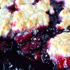 blueberry cobbler with crumbled toppings in a skillet, ready to be eaten