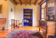 the room is clean and ready to be used as a library or sitting area for reading