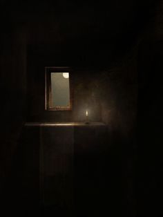 a dark room with a lit candle on the counter and a window in the corner