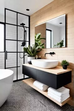 a bathroom with a sink, mirror and bathtub in it's center area