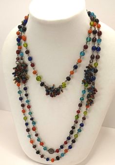 Super long, 74 inch Sautoir necklace, red, orange, blue, purple, turquoise, chartreuse. Each bead is on a wire link  with interspersed tassels. Wear long, double, triple very versatile! No clasp Length: 74 inches Bead widths vary from: 6 mm - 10 mm Seed Bead tassels This is vintage item it has been cleaned, inspected and found to be in good vintage condition with some minimal signs of wear.  Comes in a gift box ideal for gift giving and storage. Item# GB0020 Adjustable Multicolor Lariat Long Necklace, Multicolor Lariat Long Necklace For Gifts, Multicolor Beaded Lariat Necklace With Round Beads, Adjustable Multicolor Lariat Necklace With Colorful Beads, Multicolor Beaded Chain Long Necklace For Party, Multicolor Beaded Lariat Necklace, Multicolor Multi-strand Costume Jewelry Beads, Multicolor Long Necklace With Beaded Chain, Multicolor Lariat Necklaces For Party