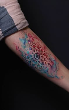 a person with a colorful tattoo on their arm