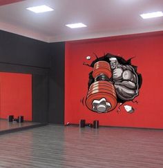 an empty room with red walls and a large mural on the wall that has a punching fist coming out of it