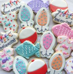 decorated cookies are displayed on a table