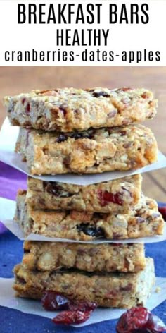 three bars stacked on top of each other with cranberries and dates in the middle