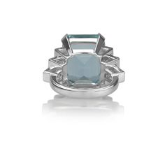 Maker: Mureta & Co. Composition: Platinum Primary Stone: Aquamarine Stone Weight: 16.58 Carats Accent Stone(s): Diamond Stone Weight: 1.03 Carats Total Color: F-G Clarity: VS-SI Shape: Princess Cut Size: 6.75 Weight: ﻿17.3 Grams Serial: M&C00150 Luxury Platinum Topaz Gemstone Ring, Luxury Topaz Ring With Prong Setting, Luxury Platinum Topaz Ring With Prong Setting, Luxury Topaz Baguette Cut Ring For Formal Occasions, Luxury Formal Baguette-cut Topaz Ring, Luxury Formal Baguette Cut Topaz Ring, Luxury White Gold Topaz Ring, Luxury Round Cut Topaz Ring, Luxury Blue Topaz Baguette Cut Rings