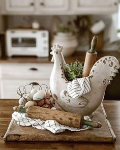 a wooden cutting board topped with an egg holder