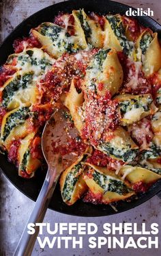 stuffed shells with spinach and cheese in a skillet