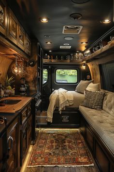 the interior of a camper with a bed and couch