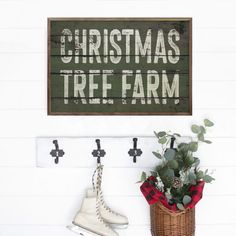 a christmas tree farm sign hanging on the wall