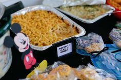 mickey mouse macaroni and cheese is on the table with other items for sale