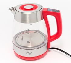 a red and silver tea kettle sitting on top of a white table