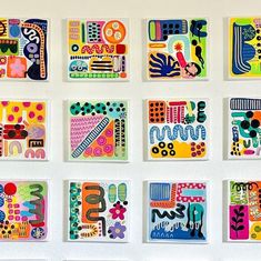 six square pieces of colorful art hanging on a wall