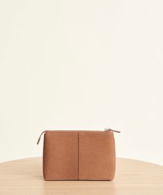 Small Zip Pouch Walnut Our Small Zip Pouch is the ultimate accessory for an organized and highly stylized approach to living. Pair it with our Oiled Leather Tote for an added take on simplicity. Nubuck oiled leather with silver hardware. Handmade in Italy. Luxury Tan Pouch Bag, Luxury Light Brown Bag With Removable Pouch, Luxury Leather Pouch With Zipper Closure, Luxury Textured Leather Everyday Pouch, Modern Leather Pouch With Leather Lining, Modern Pouch With Leather Lining For Daily Use, Modern Leather-lined Pouch For Daily Use, Versatile Leather Clutch With Smooth Grain, Minimalist Leather Clutch Pouch