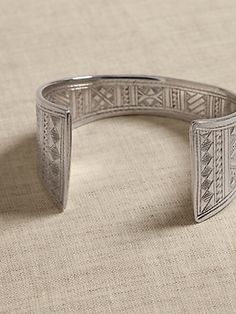 Crafted by hand, this rounded cuff style displays the expert hand of its Tuareg makers: a hand-hammered shape, intricate filling, and ornamental engravings that are equal parts ornament and talisman.  ETHNOPUR: Ethnopur works with and supports artis Women's Jewelry And Accessories, The Expert, Jewelry For Women, Cuff Bracelets, Banana Republic, Handmade Jewelry, Cuff, Women Jewelry, Sterling Silver