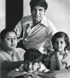 an old black and white photo of three people with one child on the other side