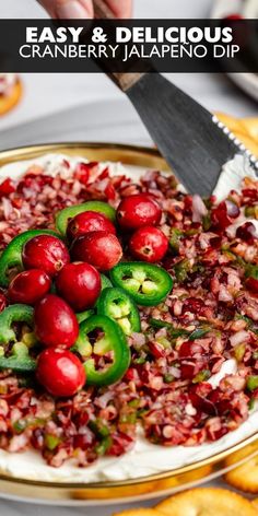 cranberry jalapeno dip on a gold platter with crackers