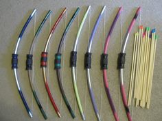 an assortment of different types of bow and arrow bows laid out next to each other