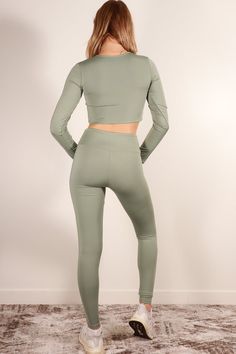 A polyamide elastane set featuring a long sleeve crop top, high waist leggings, and 4 way stretch from Capella Apparel Activewear Style Number: ATP71016 Fabric Details: 80% Polyamide, 20% Elastane Model is 5'9" and is wearing a Small Top - Bust: 13", Body Length: 14", Sleeve Length: 23" Bottom - Inseam: 27", Waist: 11.75", Total Length: 36.75" Activewear Style, Leggings Activewear, High Waist Leggings, Activewear Fashion, Activewear Sets, Active Wear Leggings, Long Sleeve Crop, Short Jumpsuit, Fabric Details